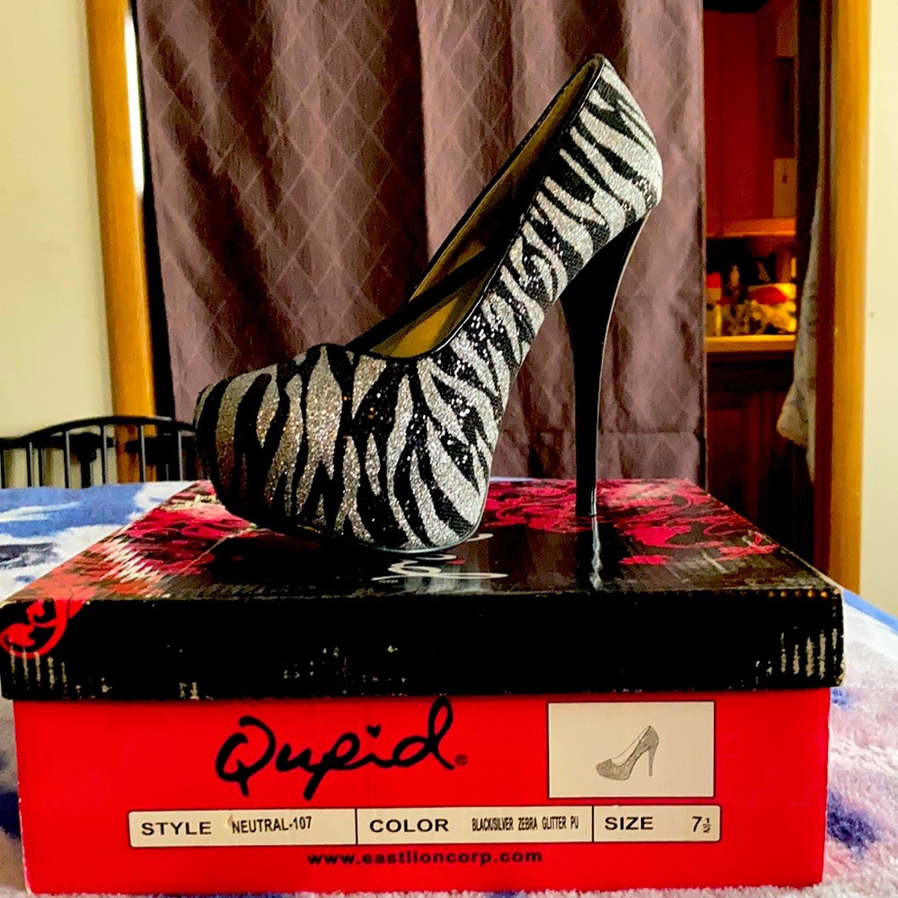 Cupid black and silver glitter platform pumps.